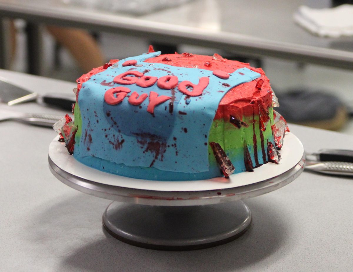 The Chucky cake made in third period utilizes multiple colors of fondant and splashes of red frosting to create the layers of Chucky's outfit.