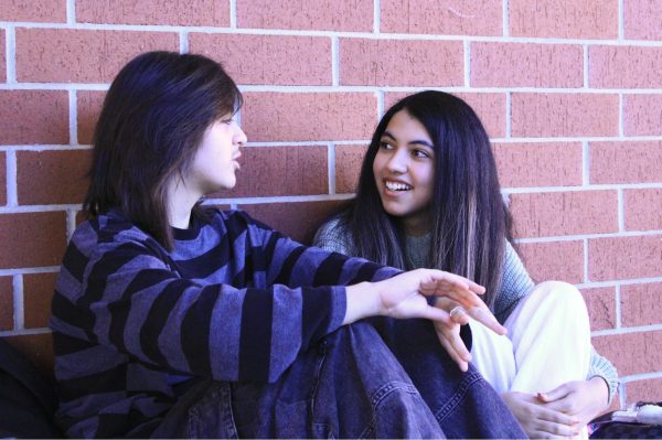 Junior Priscilla Fajardo eats lunch with friends who also speak Spanish. Sharing a language allows Fajardo to speak comfortably at school.