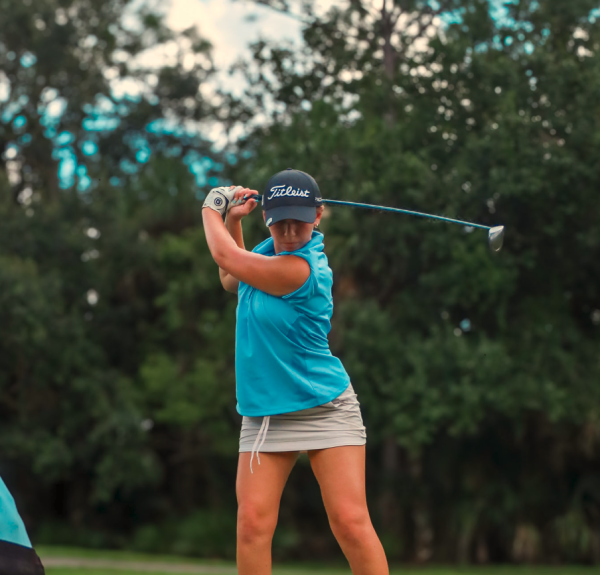 Gabriella Heina takes her backswing before hitting the ball. She shot a 99 in districts and 94 in regionals. 