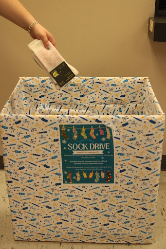 Sock box drop off located in the front office where students can donate socks.