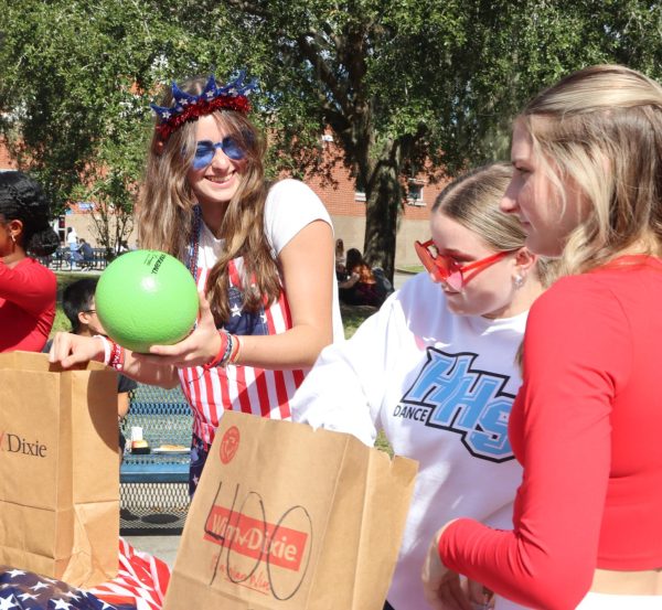 Executive board vice president Celine Merlin helps run a game for club carnival. As a way to get clubs to participate in homecoming week, Leadership organized club crawl.