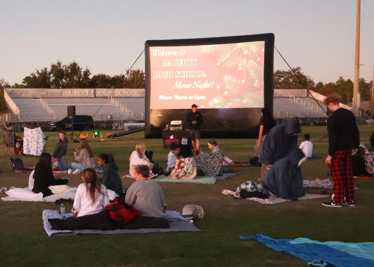 Students find spots for the Flick on the 50 movie on Thursday of Winter Week. Over 300 tickets were sold to watch "Home Alone." (photo by Antonio Pizza)