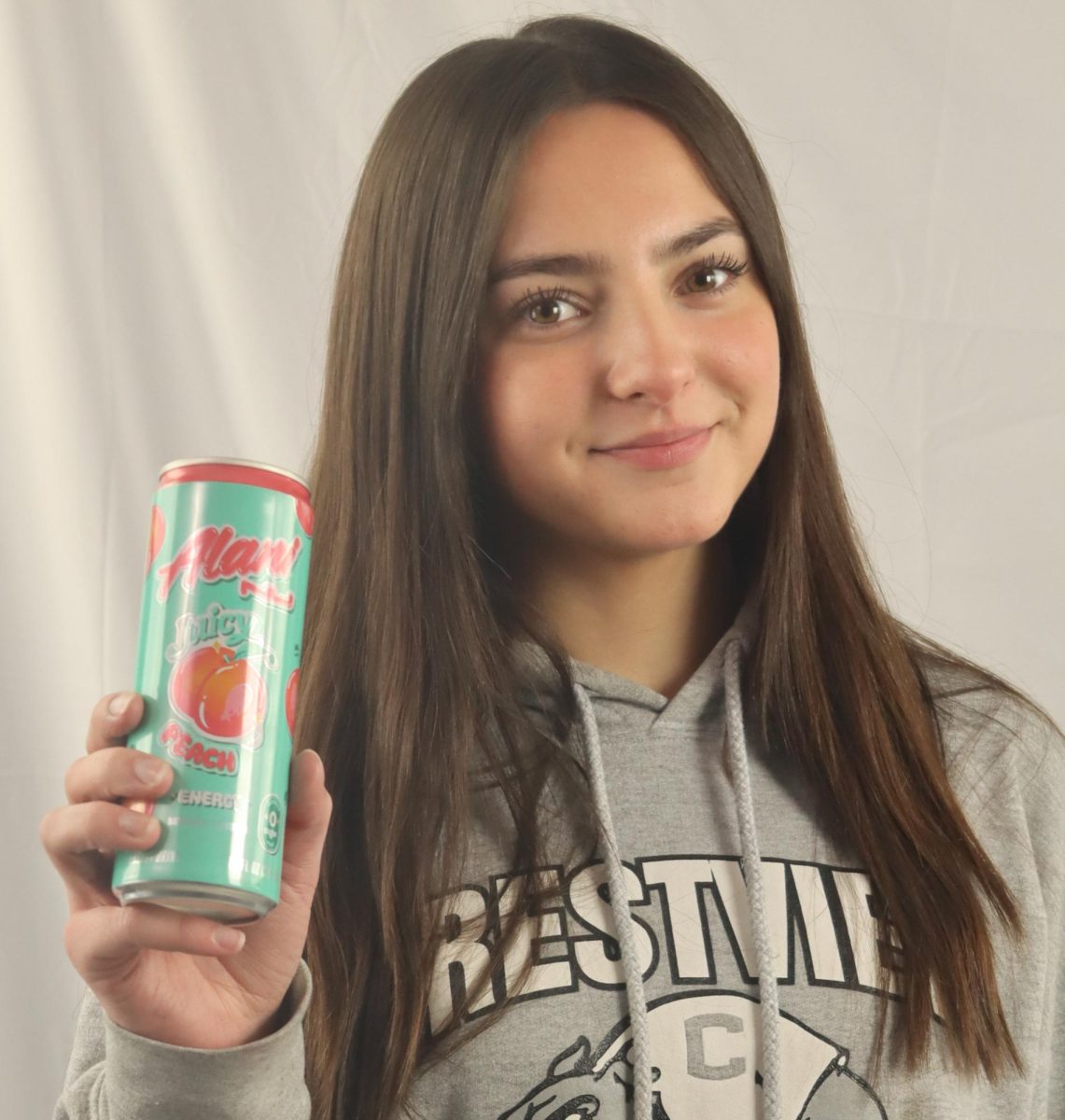 Sophomore Sophia Austin drinks juicy peach Alani. Alani comes in 13 different flavors.