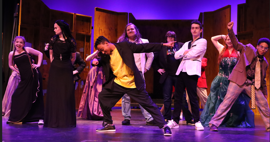 The cast of "Puffs" dances during a song break, led by Cedric (junior Jolin Alcindor). The cast is comprised of 16 actors.