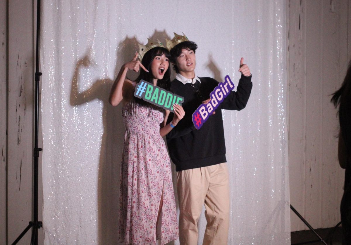 Senior Jason Hu poses with a friend from another school at the beginning of the night. Supervised by the Orlando Asian Student Association, the Winter Ball consisted of 13 schools from the Seminole and Orange counties.