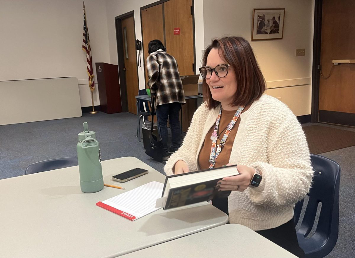 Librarian Sarah Viviani shares her book at a Teen Book Talk. Viviani organizes Teen programs at the East Branch of the Seminole County Public Library.