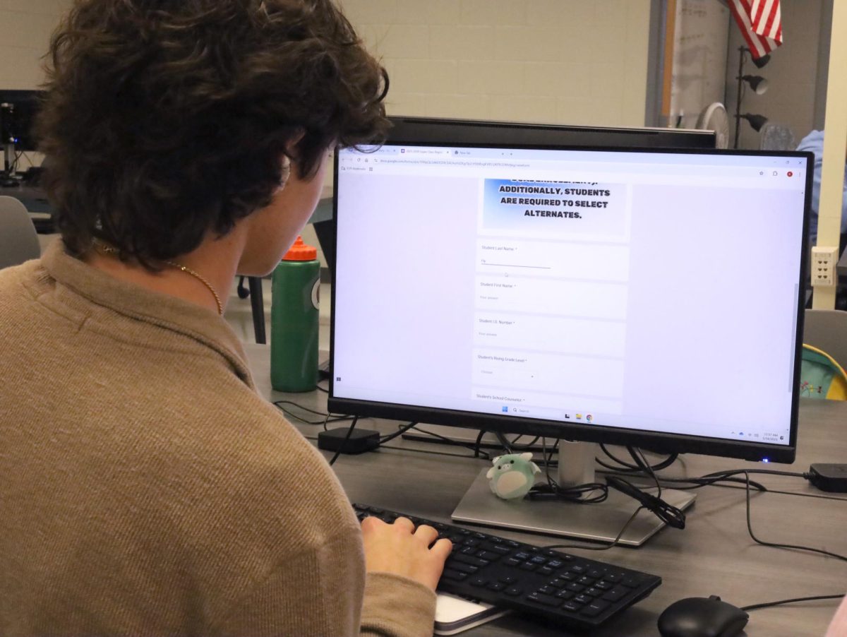 Sophomore Collin Flynn signs up for courses. Students now have to fill out a Google form to choose their classes for the following school year.