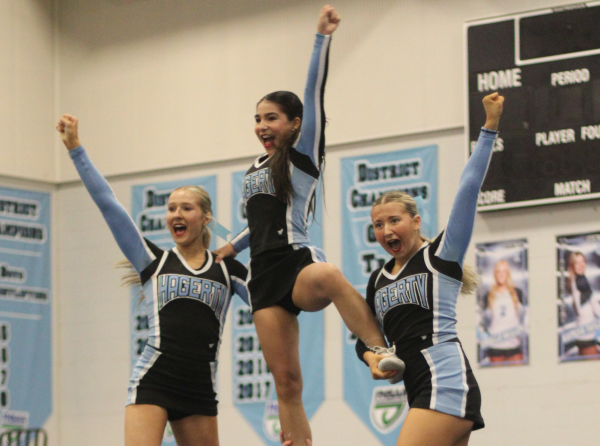 Members of the varsity cheer team perform at regionals in the Hagerty gym on Saturday, Jan. 19. The team took first place with a score of 84.9 points and will compete for a state title on Feb. 1.