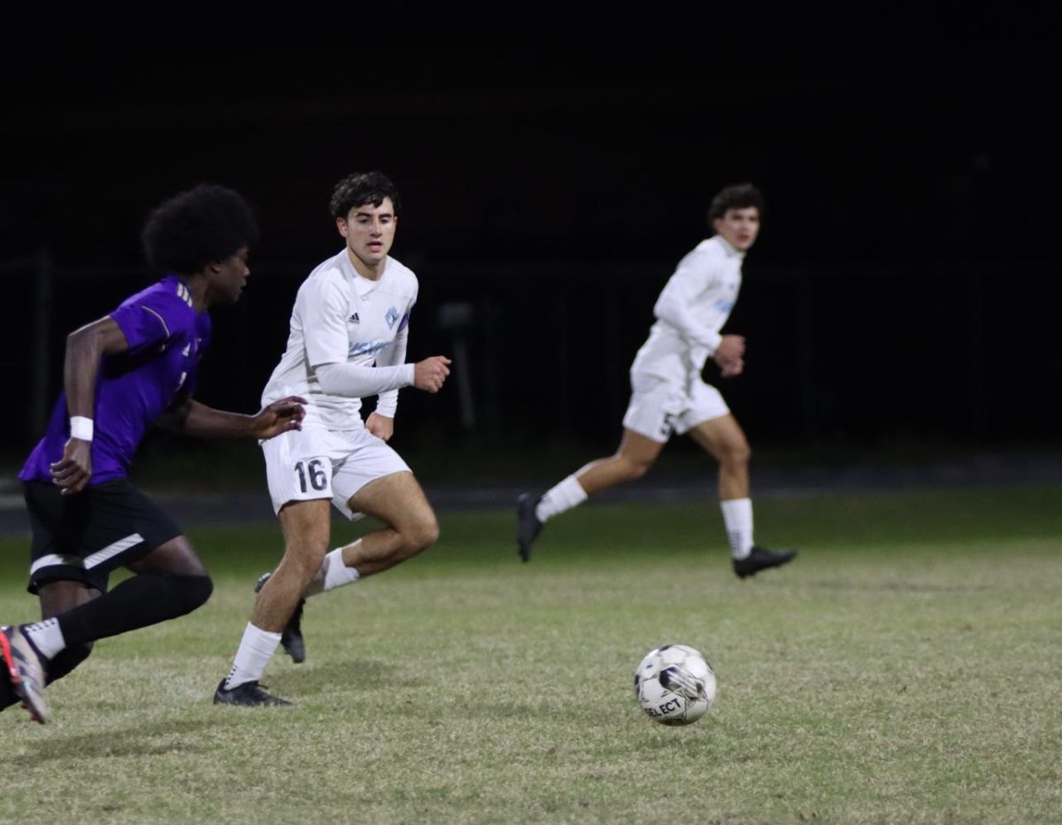 Defender Mohamad Mutawe dribbles the ball at a game against Winter Springs. Hagerty lost their undefeated title after a 3-1 loss on Jan. 15.
