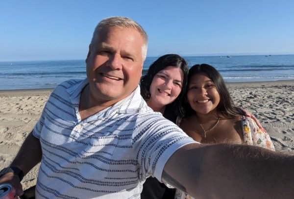 Senior Lila Powell smiles with her adopted mom and dad while on vacation. Powell was adopted when she was nine months old from Guatemala.