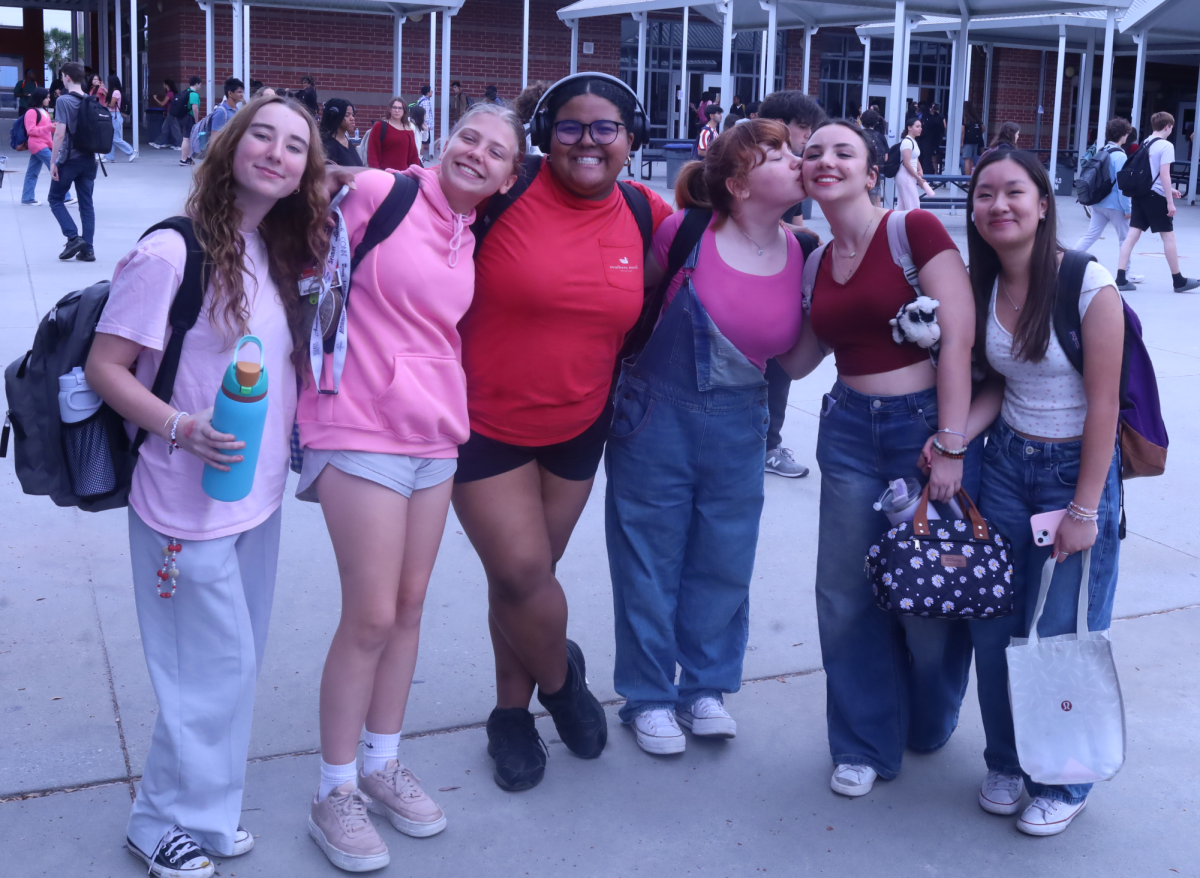 Friday: "Cupid's Colors." Freshmen Courtney Archer, Cristiana Shobe, Payton Zeegers, and Layla Dashi all dress in pink, white and red in accordance to the day's theme. Students were asked to dress in red, white, and pink to celebrate Valentine's Day.