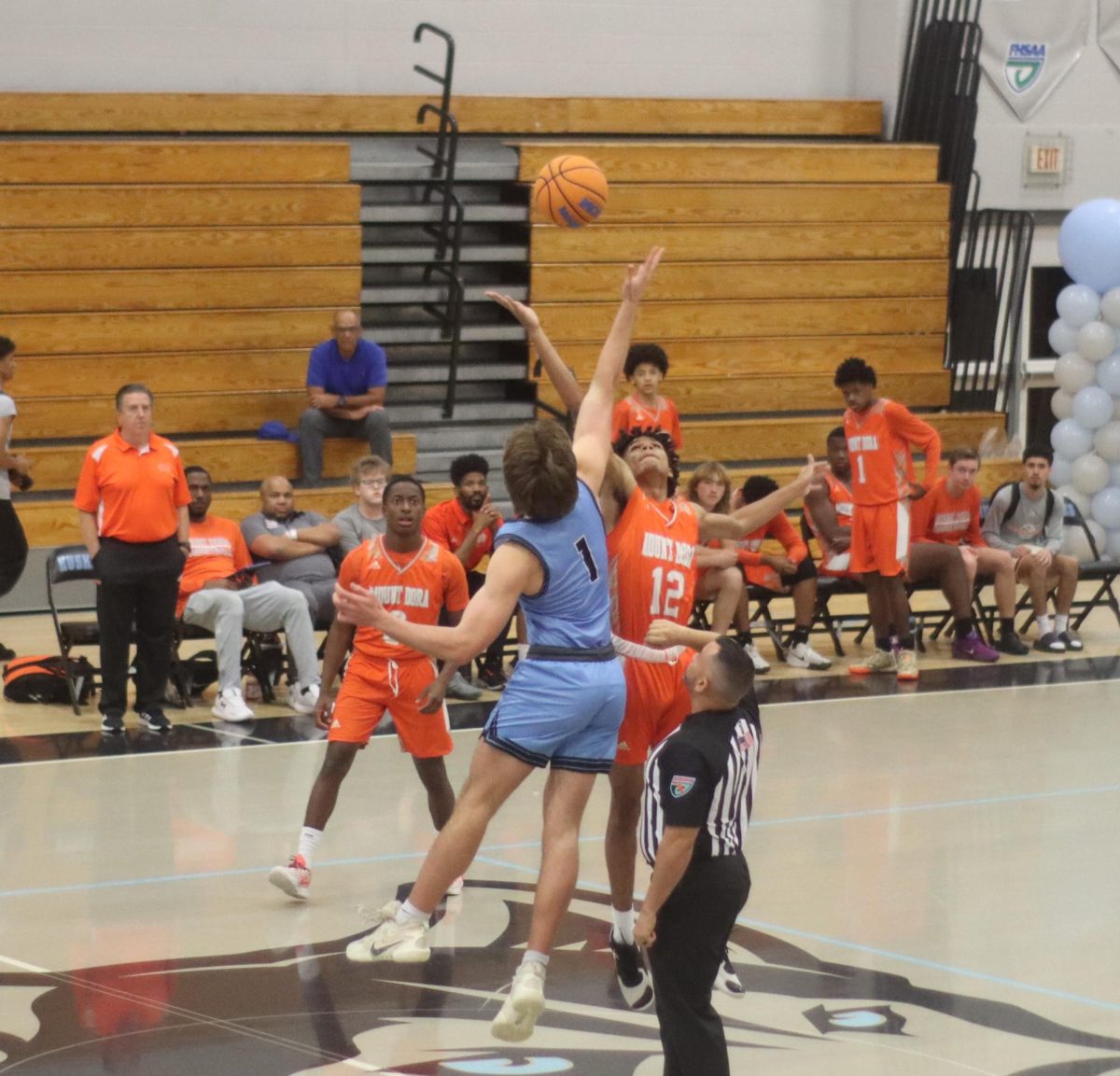 Jack Smith gets Hagerty started at tip off against Mount Dora.