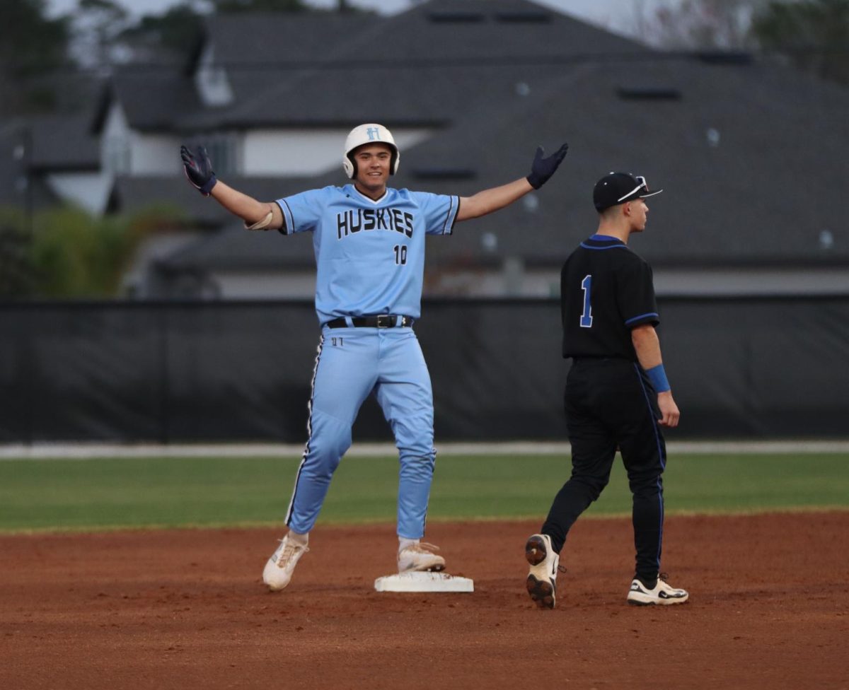 Senior pitcher Max Murray celebrates a double. The team ended their regular season 21-3-1 and ranked 13 overall in the state. 