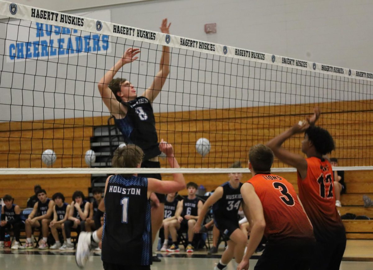 Senior Kellen Woolm spikes the ball. Woolm had eight kills in the victory over Oviedo on April 21.