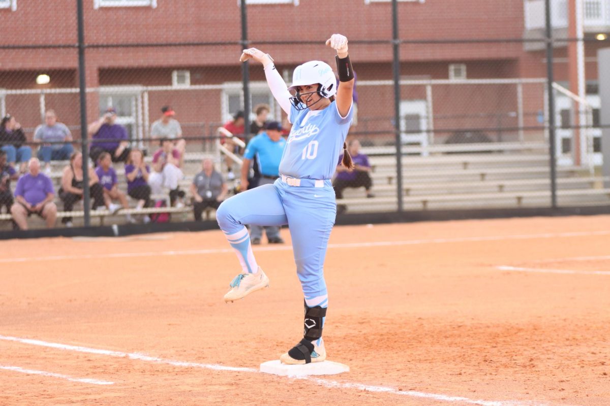 Junior Nikki Thompson celebrates on the plate. 