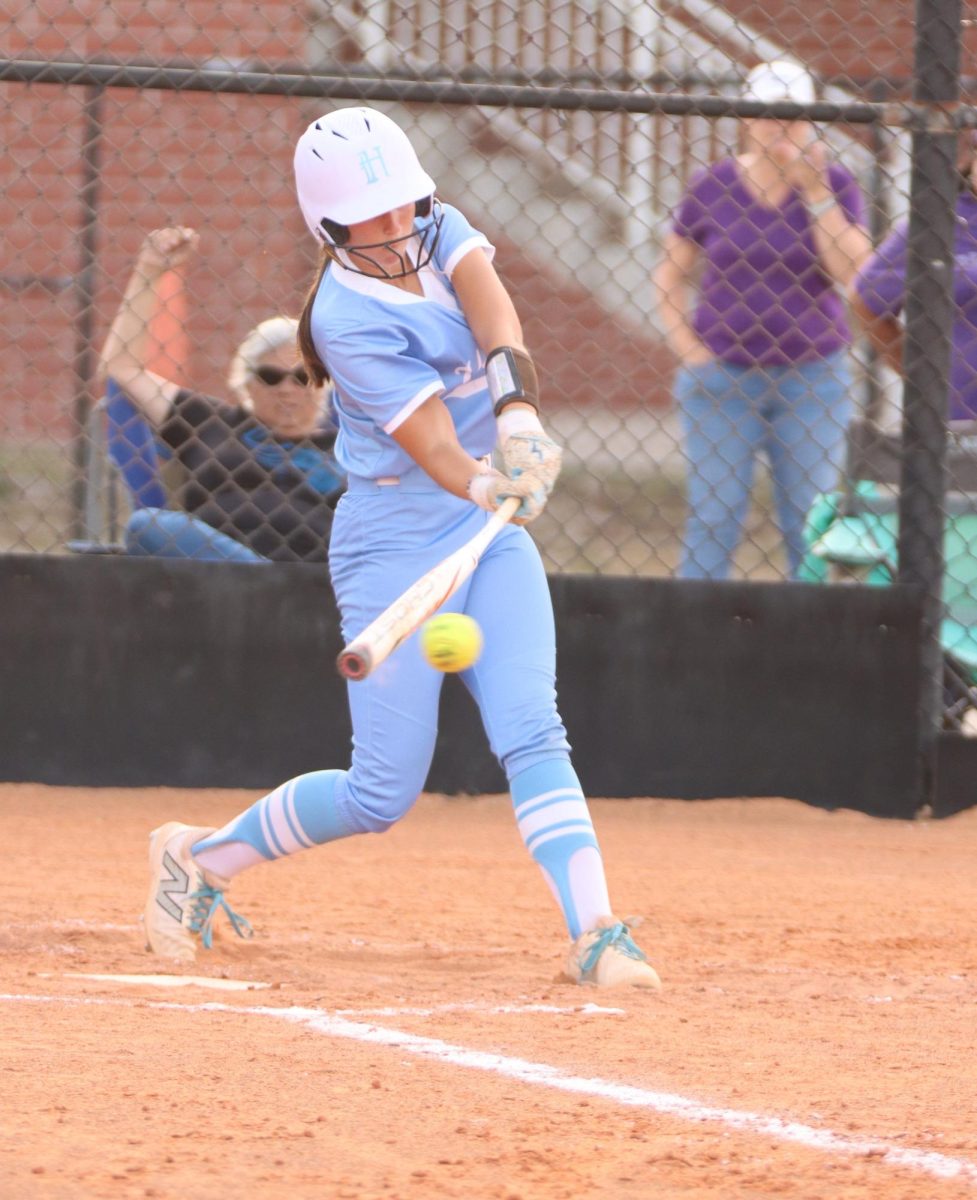 Senior Ana Roman hits the ball. 