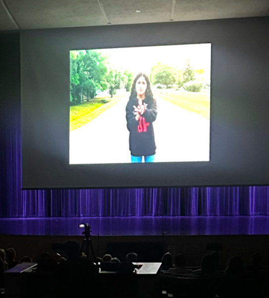 Senior Jiana Valez is shown on screen signing. During the fourth quarter students worked to create two to three renditions of various songs in ASL.