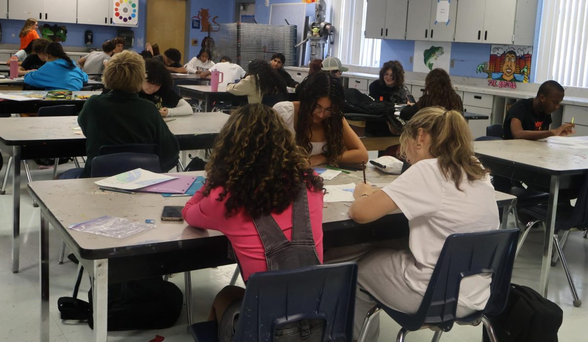 Students work on their art projects in Omar Otero's 2D art class. This is one of many classes that experiences overcrowding.