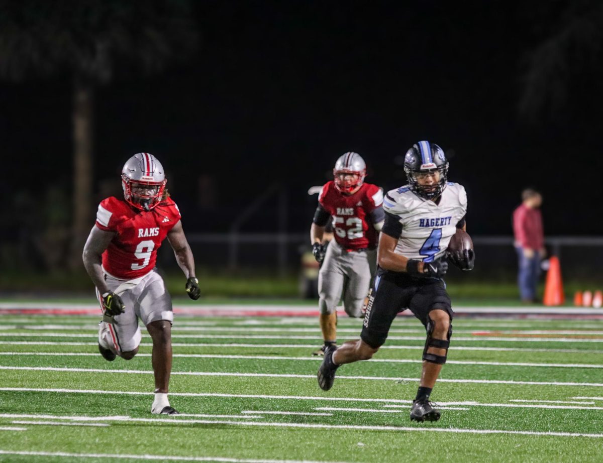 Receiver Makiye McBurse returns a punt against Lake Mary. McBurse has been one of the key players for football this year after playing three years at Winter Springs.