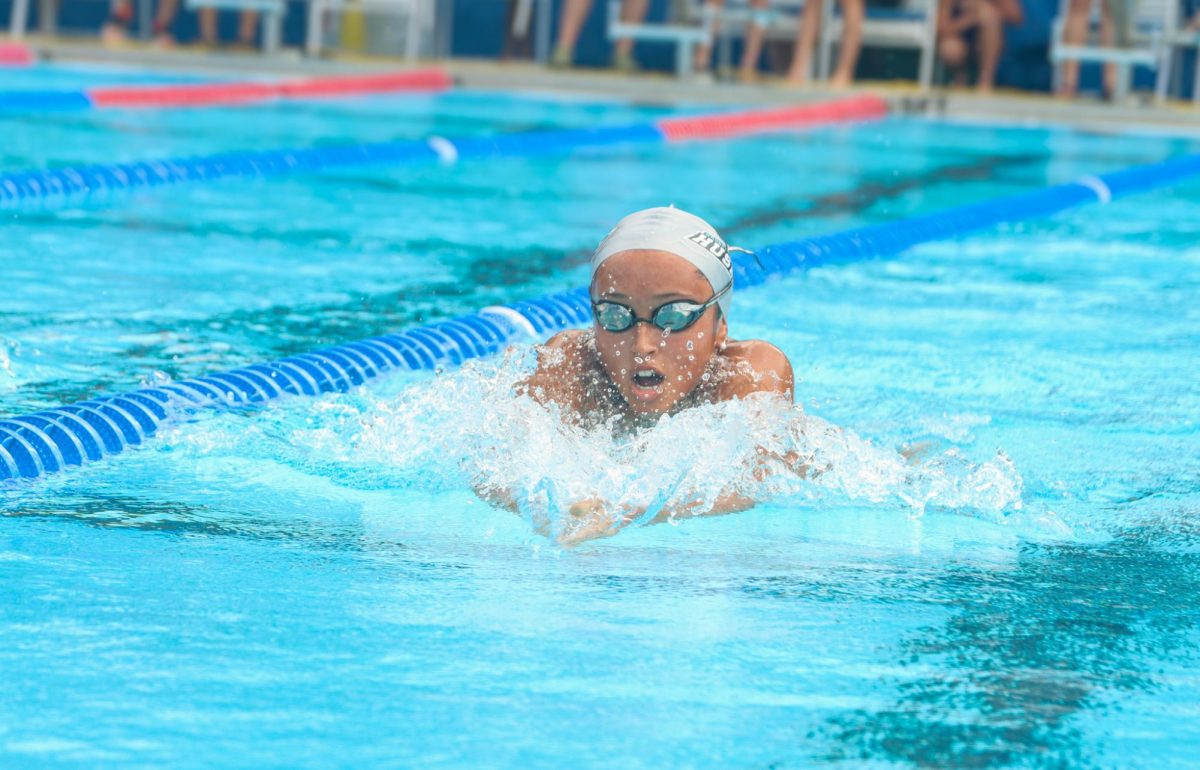 Senior Ava Medina competes in the 100-meter breaststroke event. Medina placed first in this event, contributing to  the team's second place finish.
