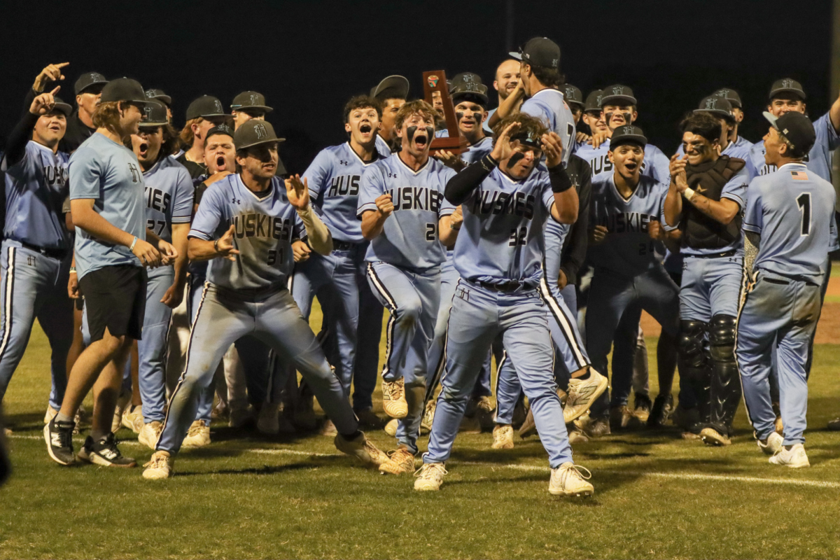 The baseball team cheers after winning the state championship. Due to the school's history of success and high standards in the baseball program, the sport sees many athletes transfer both in and out.