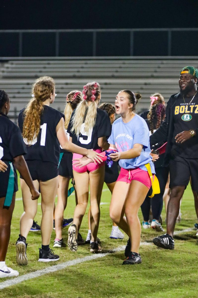 In the end of game line-up with the juniors and seniors, junior Jillian Zinnert hypes up the senior class. 