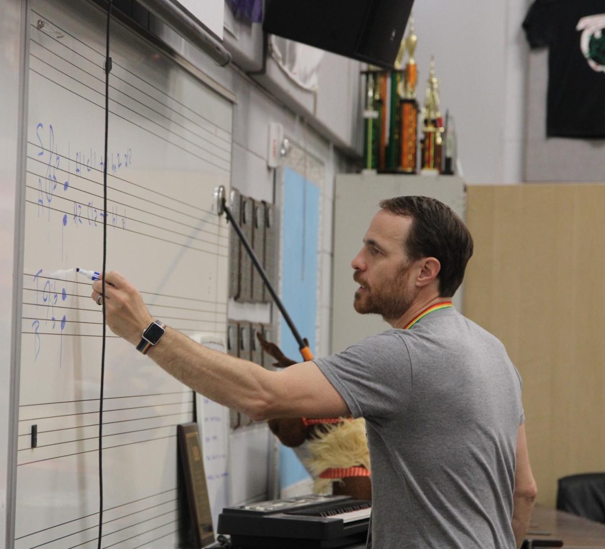 Band director Brian Kuperman explains to his students the breakdown of a chord.