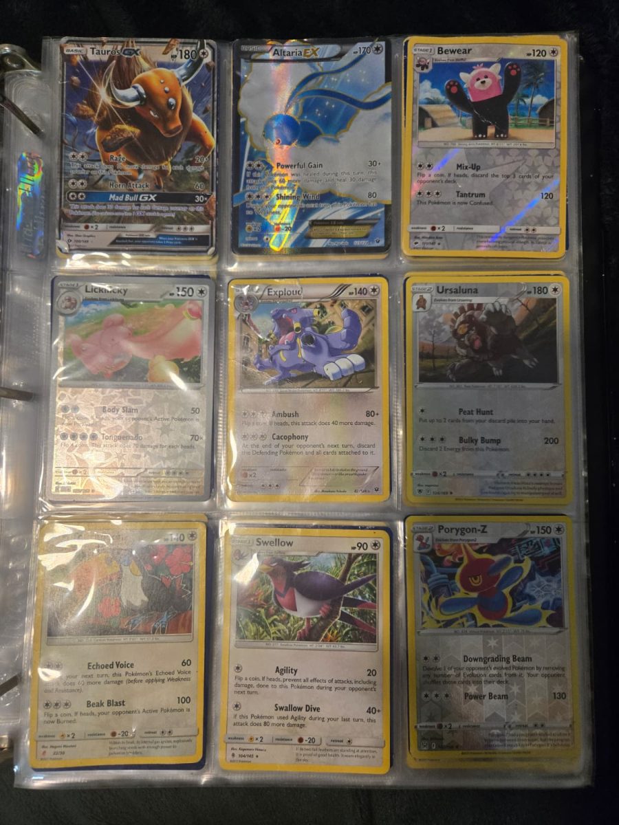 Zafarbek Tokhirjonov shows his Pokemon card collection. 