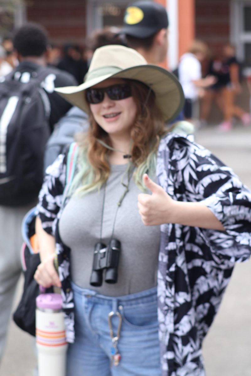 Junior Brianna Elder-Heineman shows off for Tacky tourist/landmark day, complete with a set of binoculars.