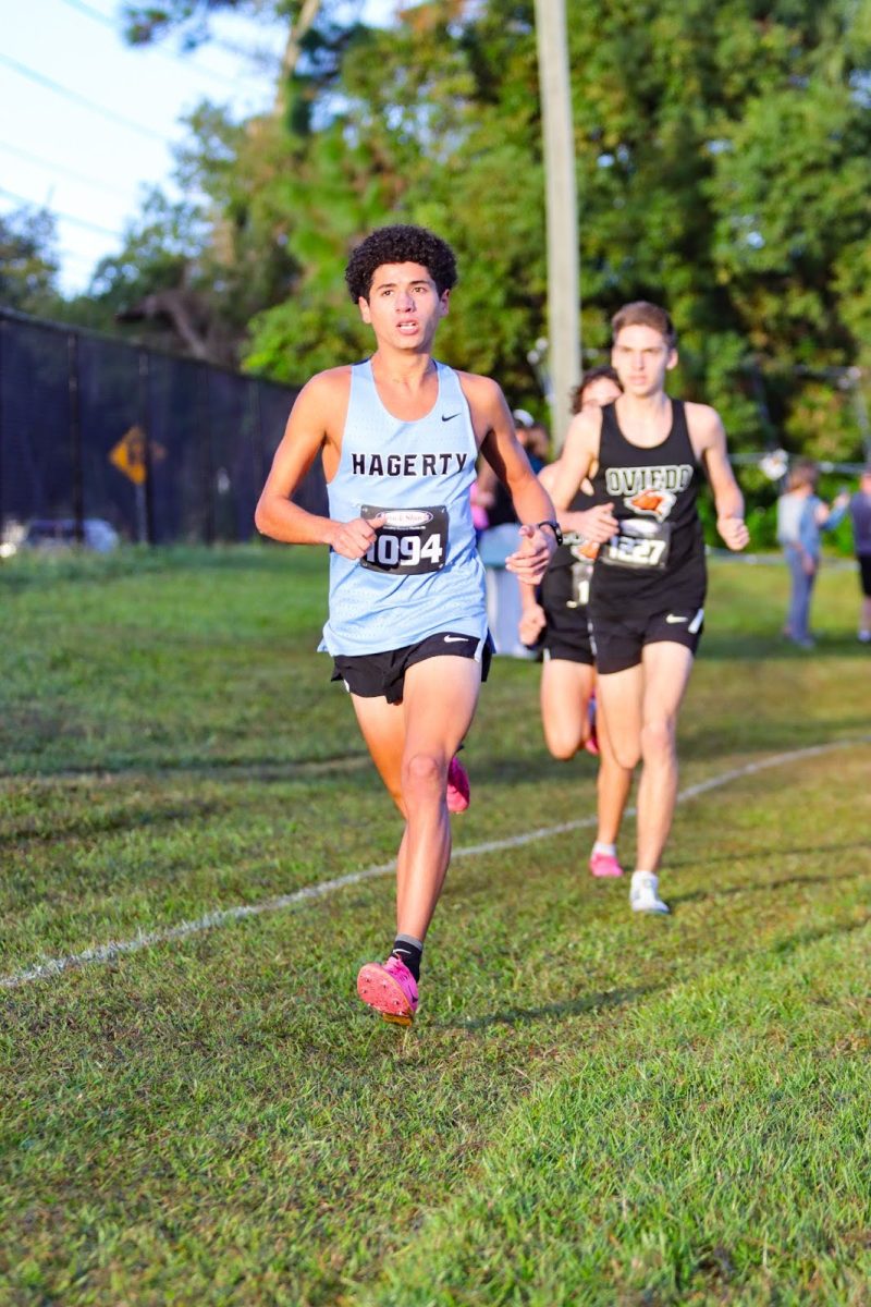 Senior Ricardo Hernandez sprints to the finish line, ending with a time of 16:58. The team celebrated their first place win, happy to beat their Oviedo rivals. 