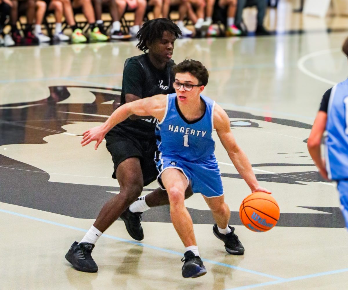 Senior Dean Vega dribbles past his defender in a preseason tournament. The boys team won their first five games in a row to start the season.