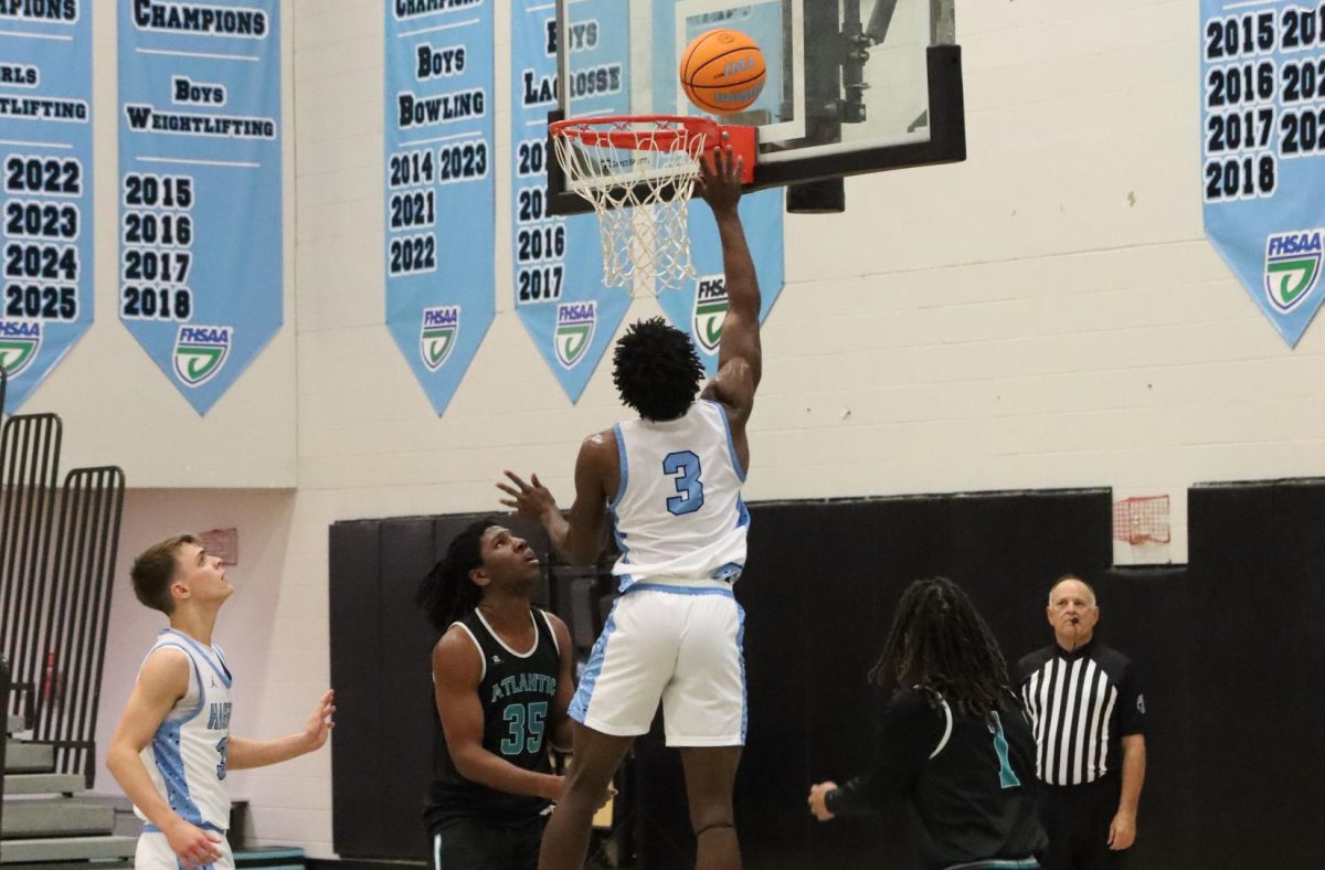 Forward Greg Weatherington goes for the layup. The huskies fell 55-73 against Atlantic Highschool