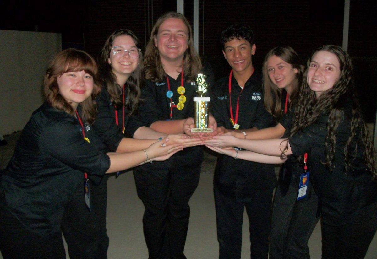 Sophomore Payton Zeegers, juniors William Lange, Sofia McLaughlin, Lana Carollo, seniors Shaun Epperson and Sam Orne celebrate after winning Top Honors for their small ensemble musical. The other acts that received Top Honors are large ensemble musical, solo musical 
duet musical and ensemble acting. (Provided by Olivia Ahqlvist)
