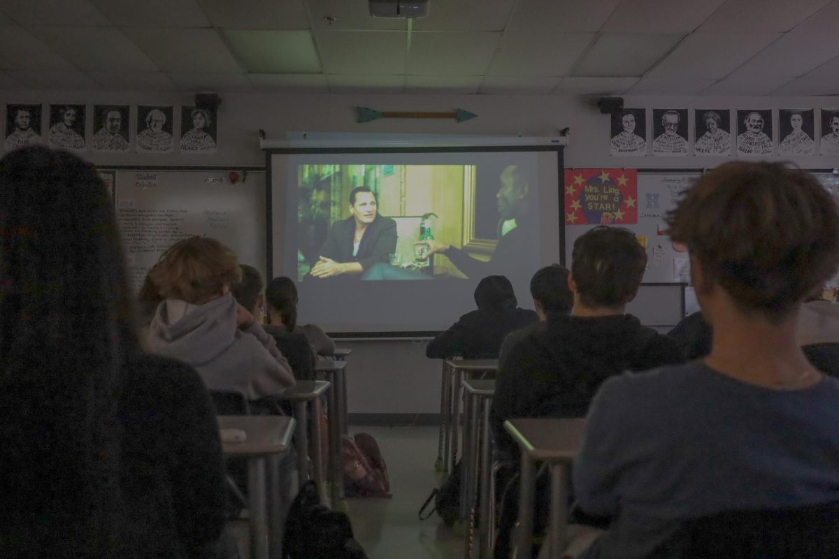  Students in Jaimie Ling’s seventh period Advanced Film Analysis watch the movie “Green Book.” 
This fits into their current unit of “based on a true story” films.