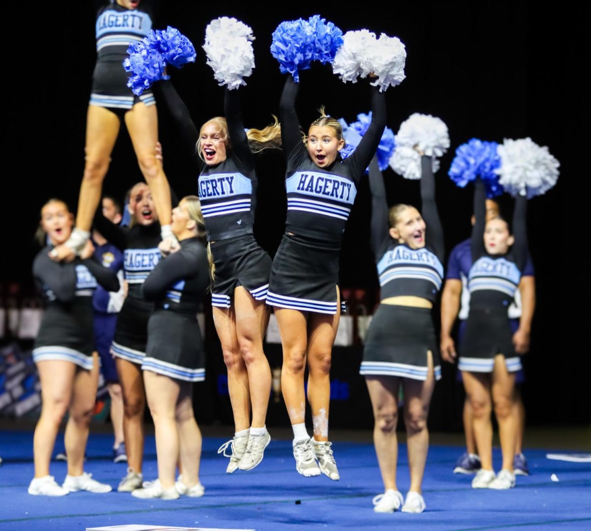 Aubree Rockwell (12) and Lila Sklar (12) get the crowd hype to put their "hands up for Hagerty" during the Cheer section of their performance. The team moves on to Nationals in February.