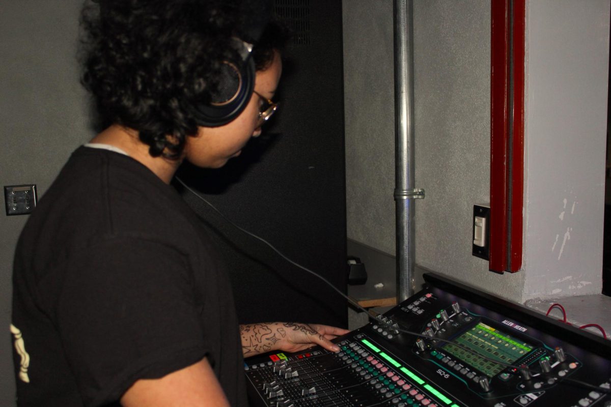 Junior Andy Lopez Vargas operates the sound board in the auditorium. He is learning how the sound board works for Technical Theater’s current unit on sound design.