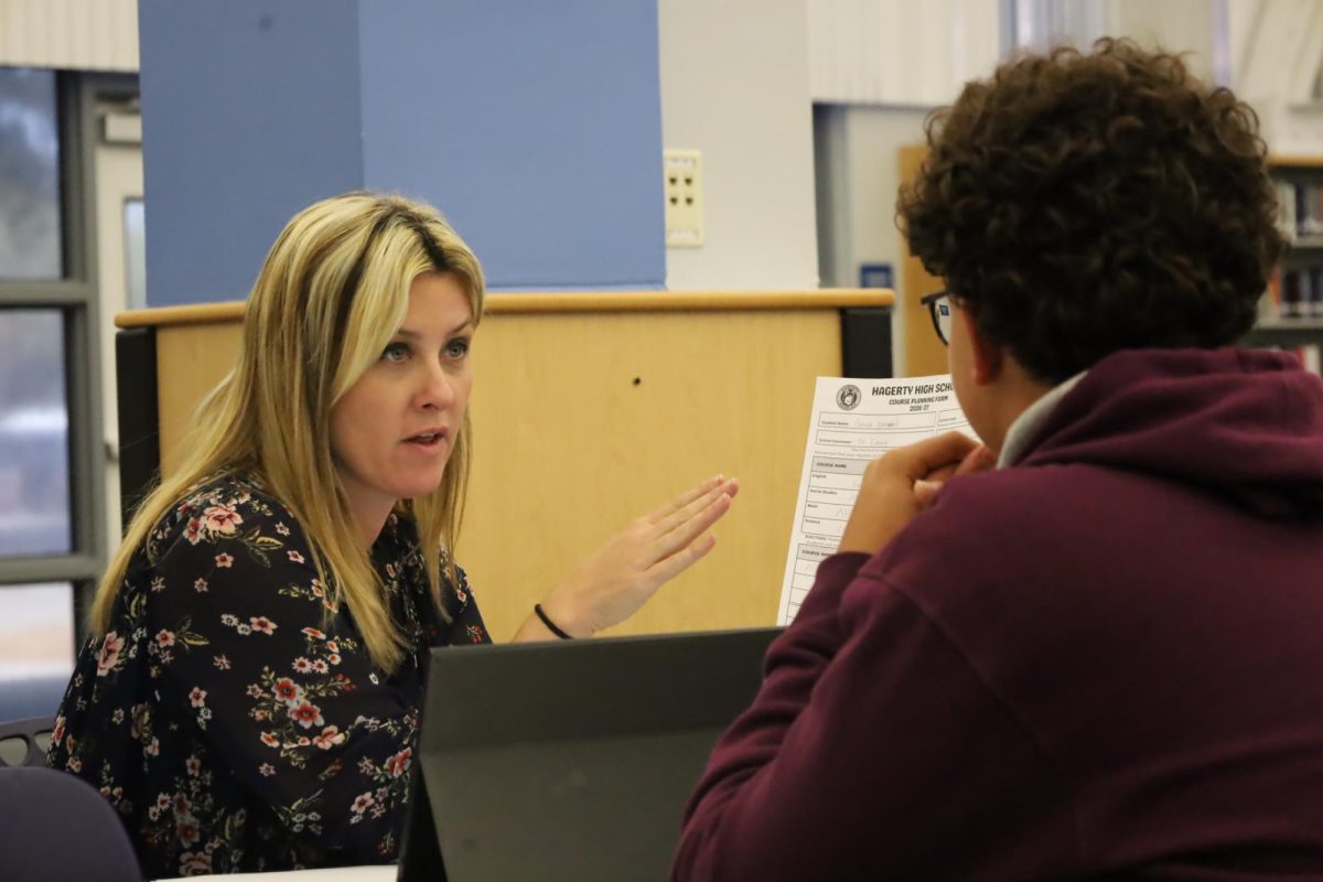 Andrea Fuhrer helps a student with their schedule change. She will be hosting the college and career fair on Feb. 26.