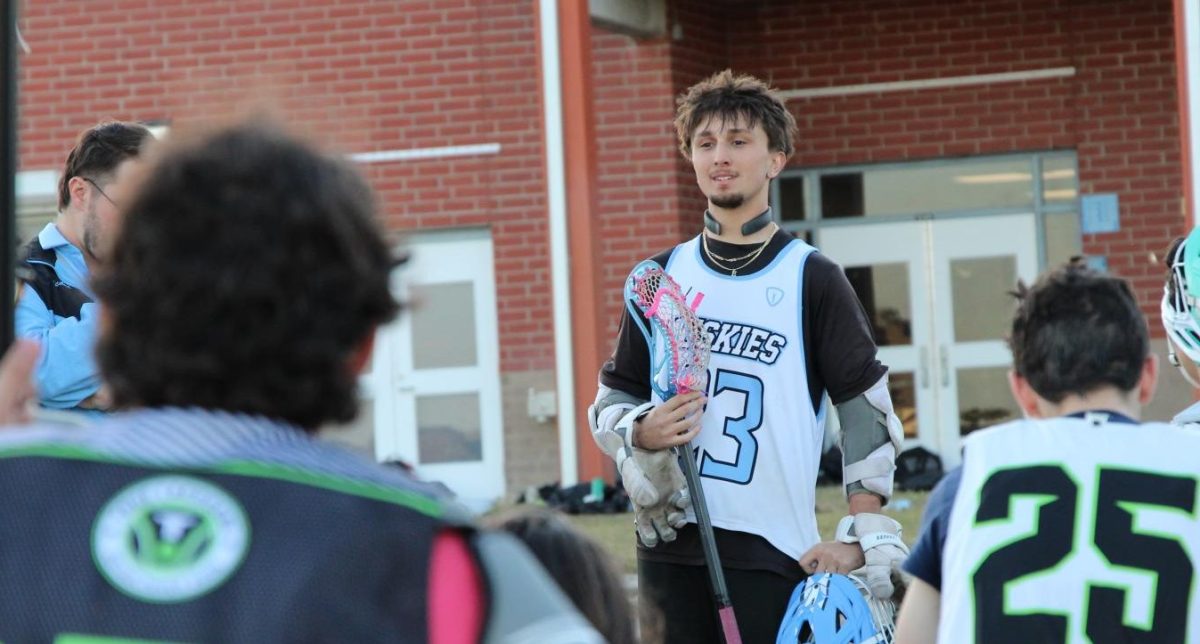 Senior Julian Fernandez gives a speech to the team. During practice, the boys elected seniors Spencer Griffith, Drake Adkins and Easton Nebel, and sophomore Colton Marcentell as team captains for the season.