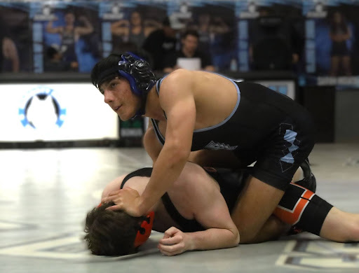 Senior Troy Aschbrenner is trying to run a half against his opponent in the 135-pound weight class. He lost the match 4-8. Hagerty beat Oviedo 53-24 on senior night. 