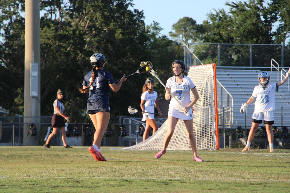 Junior Ashlyn Hamman defends the goal against Lake Howell. The team won against Lake Howell 23–4.