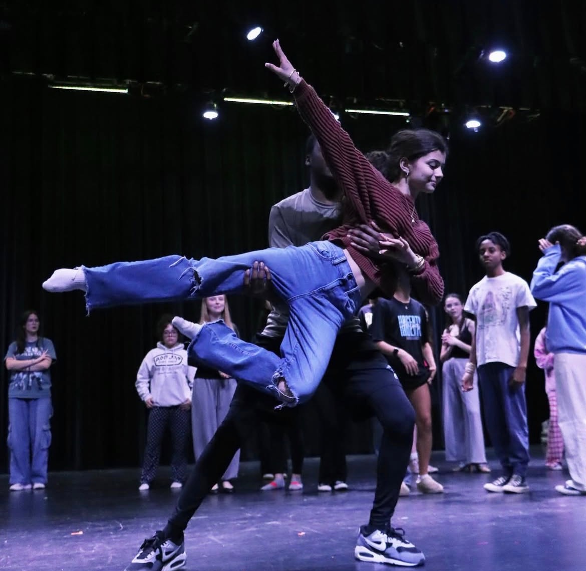 Lead Sloane Hockman practices a lift in rehearsal for “Once Upon a Mattress.” She stars as Princess Winnifred the Woebegone in the new production.