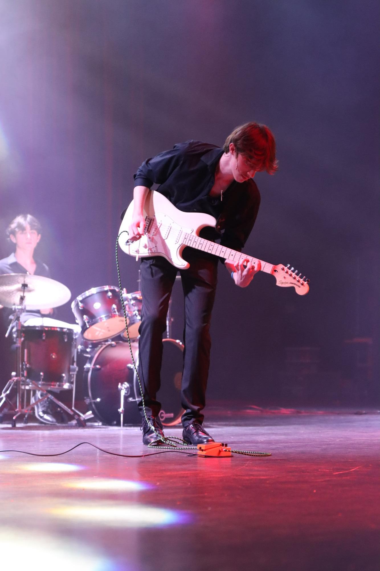 "The Agenda" bassist Alexander Adkins (12) sings Green Day's "Basket Case" and plays guitar. The student band performed as one of three entertainment acts at the award show (Photo by Stacey Roque).
