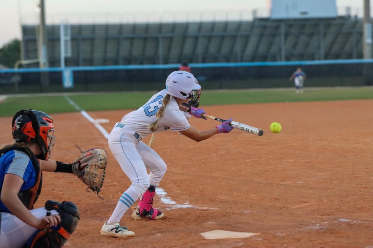 Junior Alina Gallaher bunts the ball to advance to first base. Gallaher scored the third and final run for Hagerty's 3-1 victory. 
