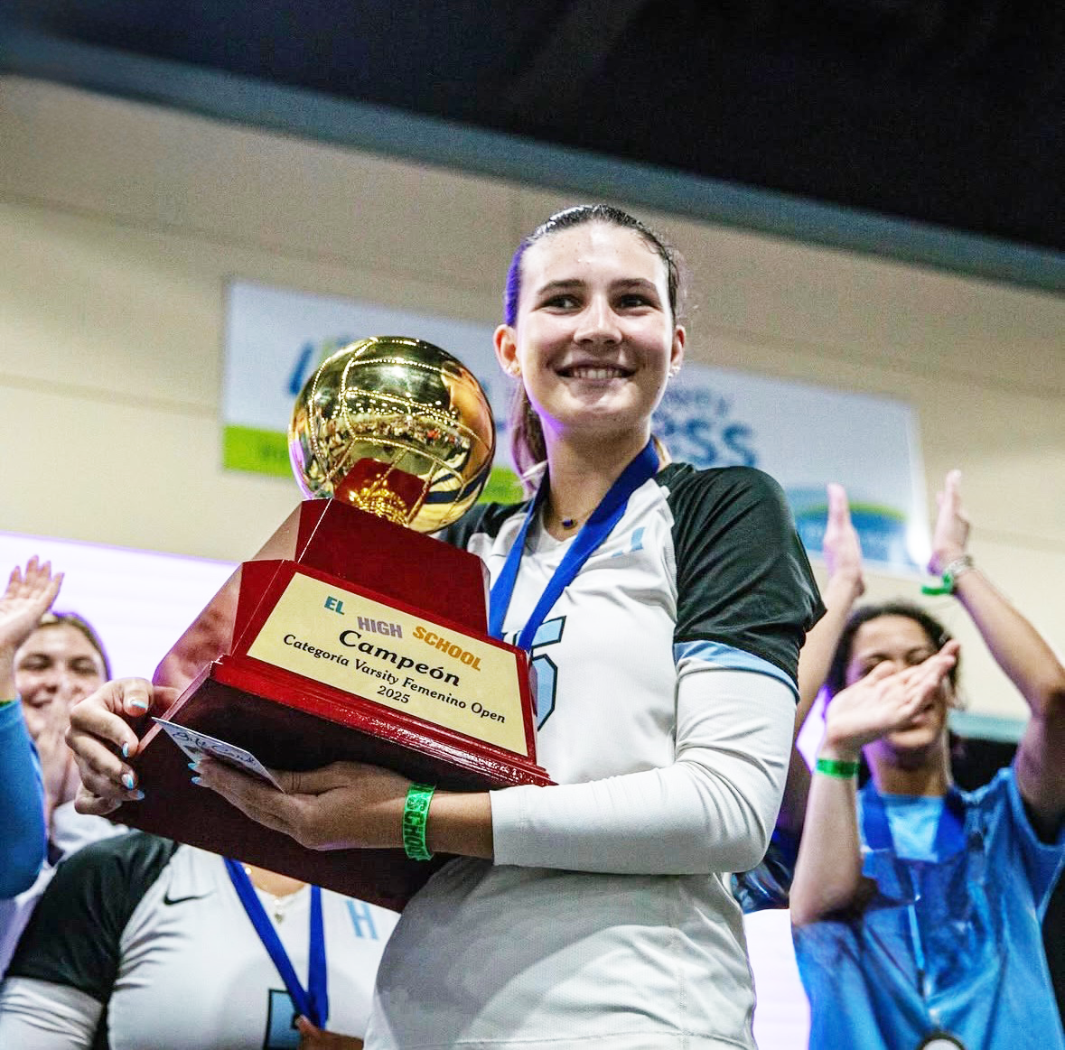 Senior Sophia Wattles holds an award the girls' volleyball team received at an out-of-state competition in Puerto Rico. Field trips give student athletes opportunities to compete in higher-level events such as these. Photo courtesy of Juanita Hitt
