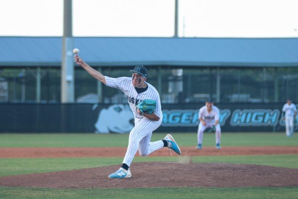 Sophomore Isaias Torres throws a pitch during the game. Torres has posted a .287 batting average and a .973 fielding percentage this season.