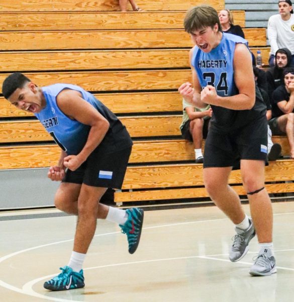 Seniors Marley Evans and Gavin Miller celebrate winning a point against Lake Mary. Though the team lost 3-2 to Lake Mary, they finished the season with a 16-10 record. (Photo by Kaden De La Rosa).