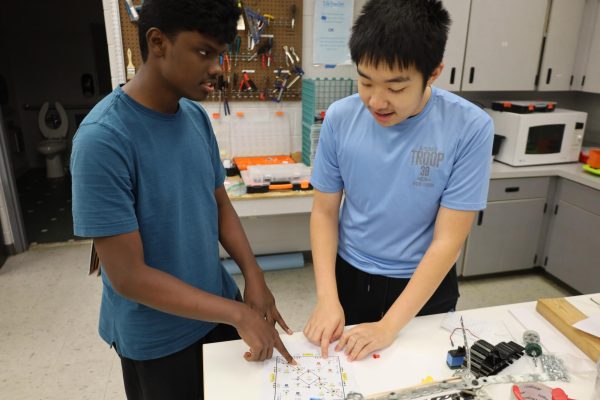 Sophmores Krishveer Sivakumar and Ryan Han checking out the field map of VEX new Game "Override".