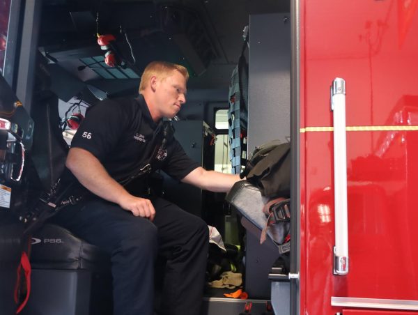 Former Hagerty student and firefighter Eric Long sits inside the firetruck. There are two main fire stations in Oviedo, station 48 and station 46. 